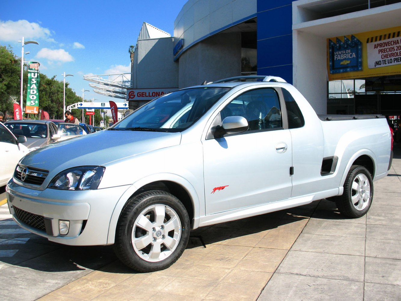 Silver compact pickup truck with single cab and sporty front design