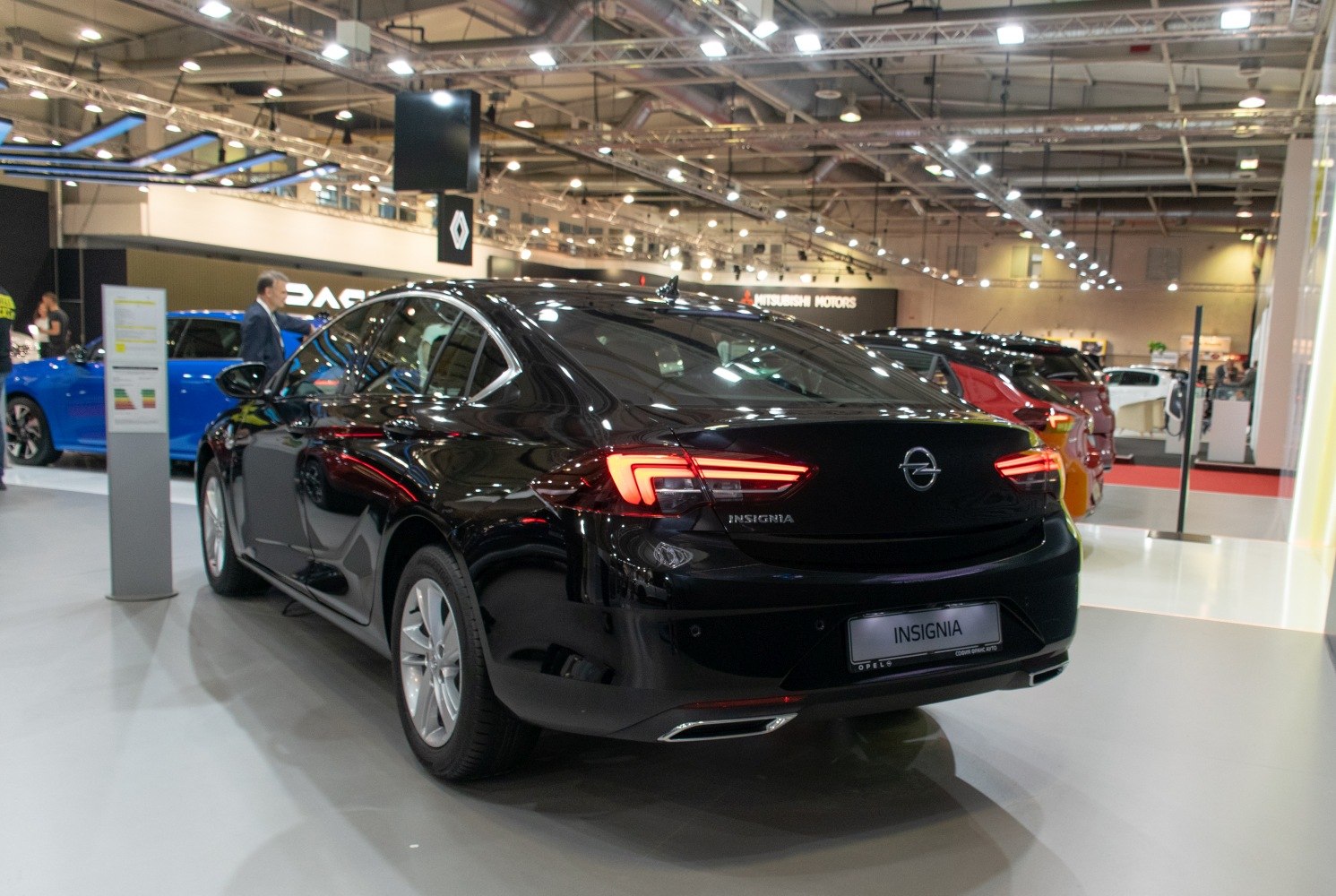 Rear view of a black sedan with LED tail lights and modern design