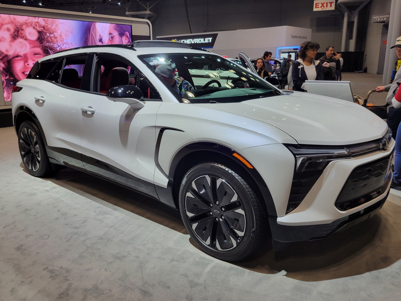 Front three-quarter view with sleek LED headlights and black alloy wheels