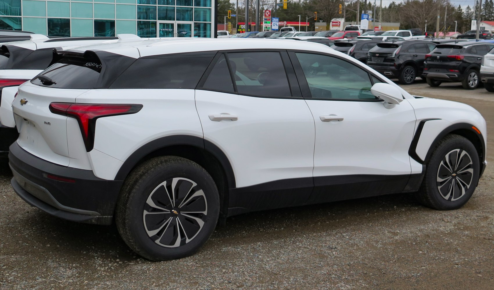Electric SUV rear side view with unique tail lights and aerodynamic features
