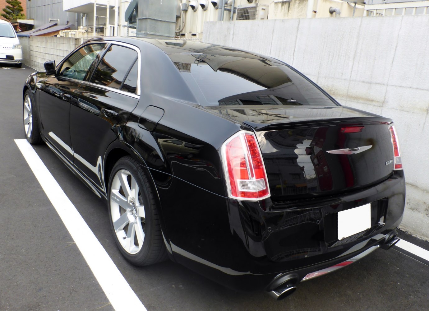 Rear and side profile with dual exhaust and distinctive taillights
