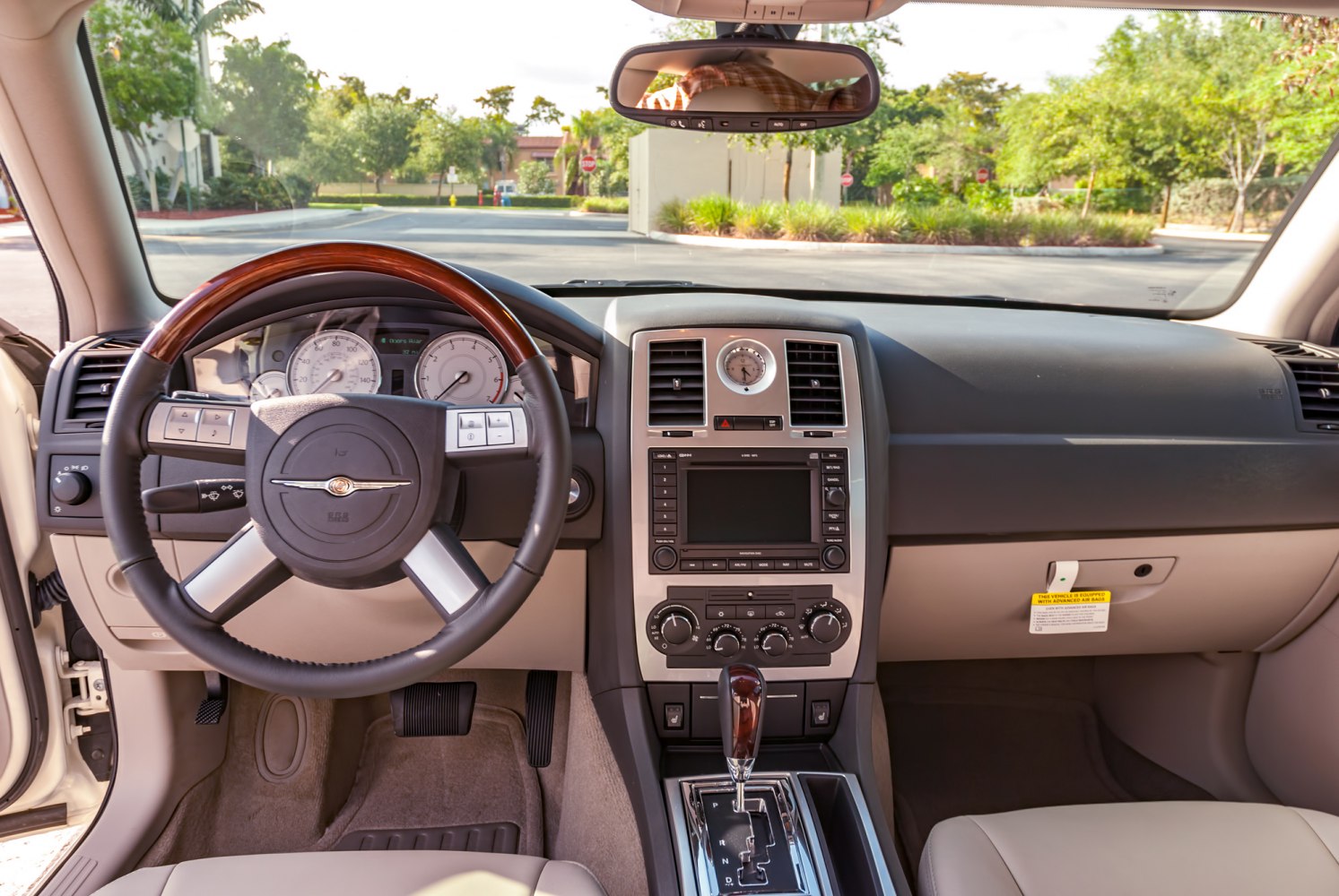Dashboard, steering wheel, center console, gear shifter, analog clock