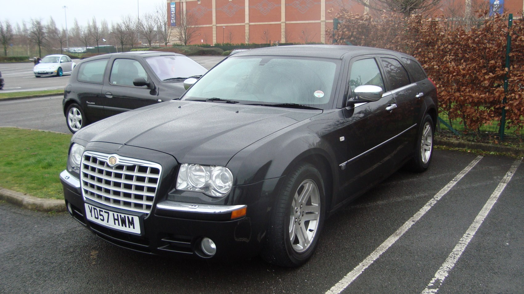 Front and side view of a sedan with distinctive grille and chrome accents