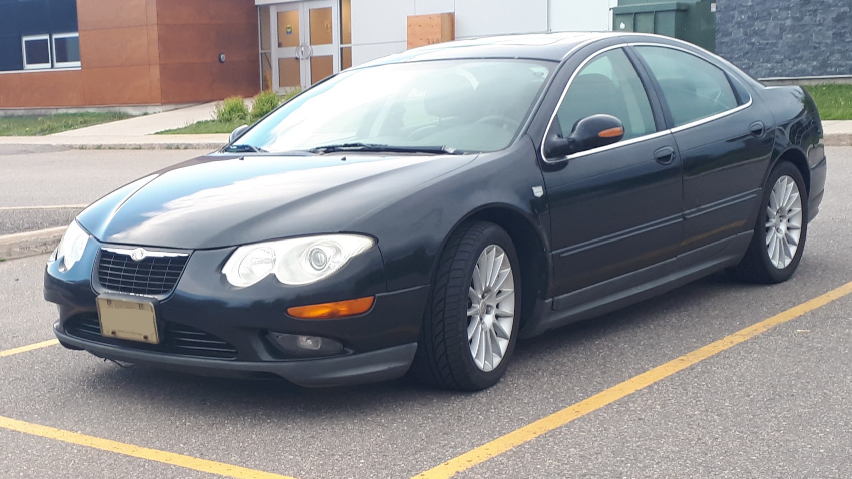 Front three-quarter view with dual rounded headlights and alloy wheels