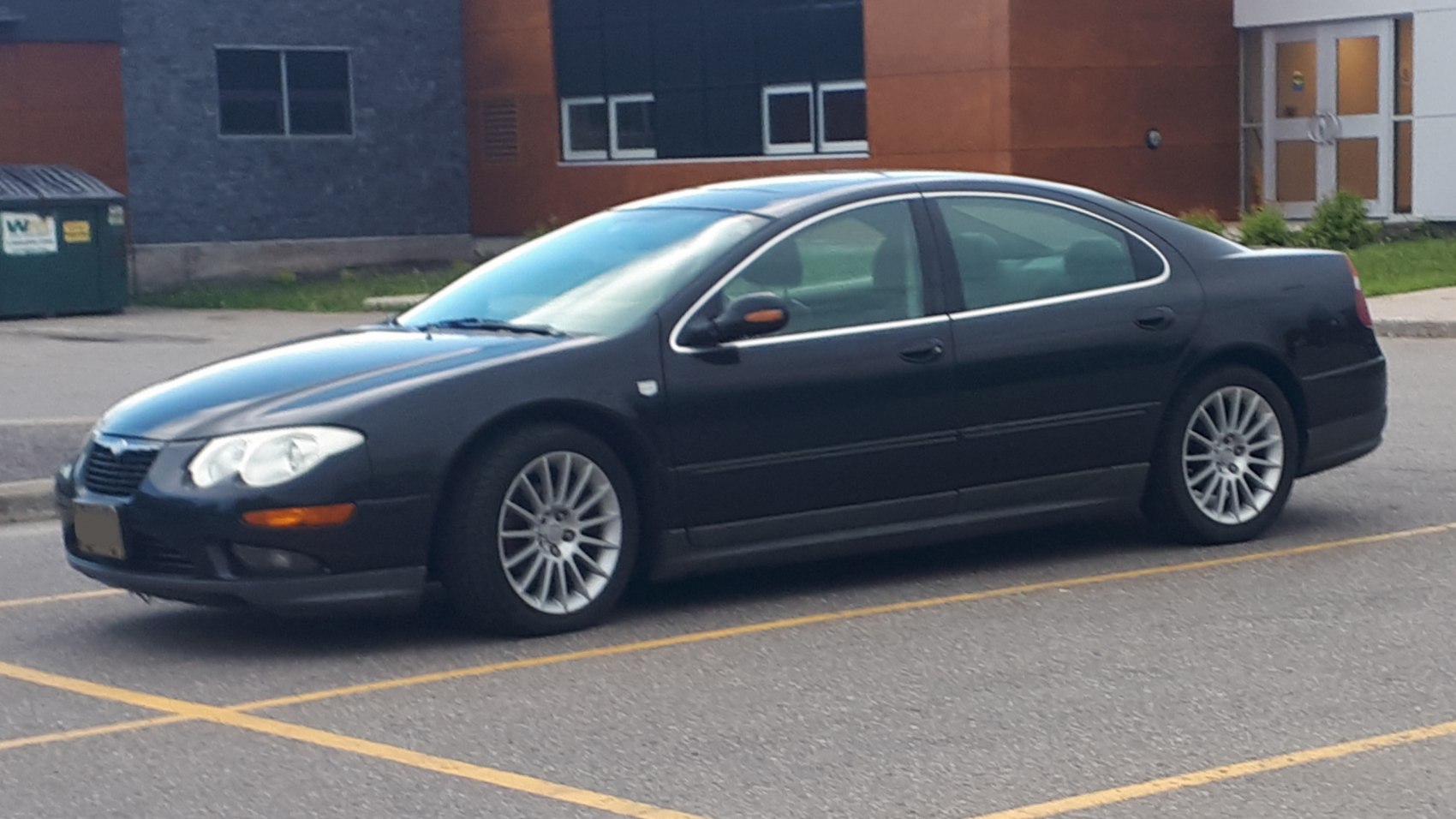 Side profile and alloy wheels of a four-door sedan