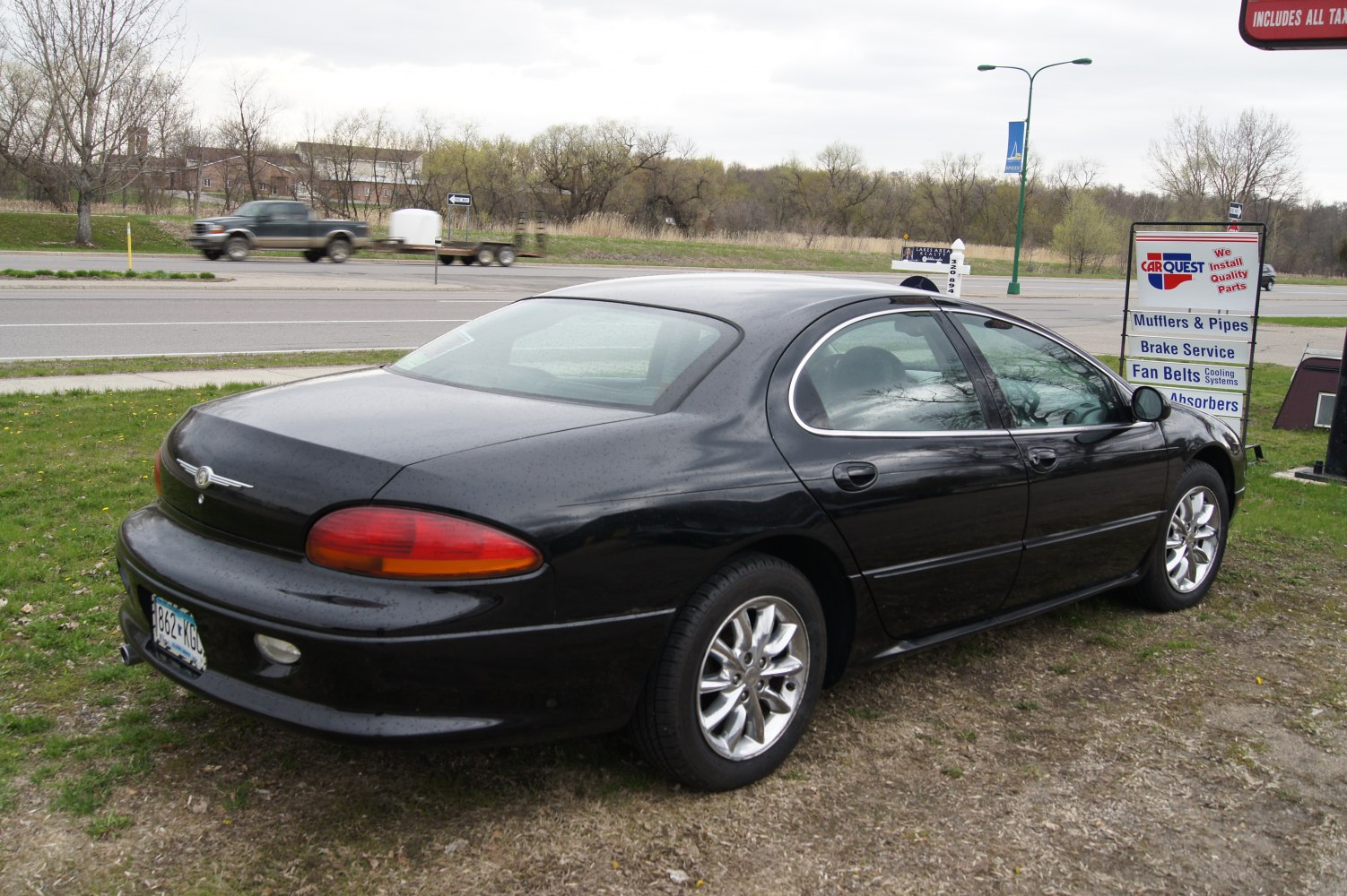 Rear three-quarter view with sleek taillights and alloy wheels