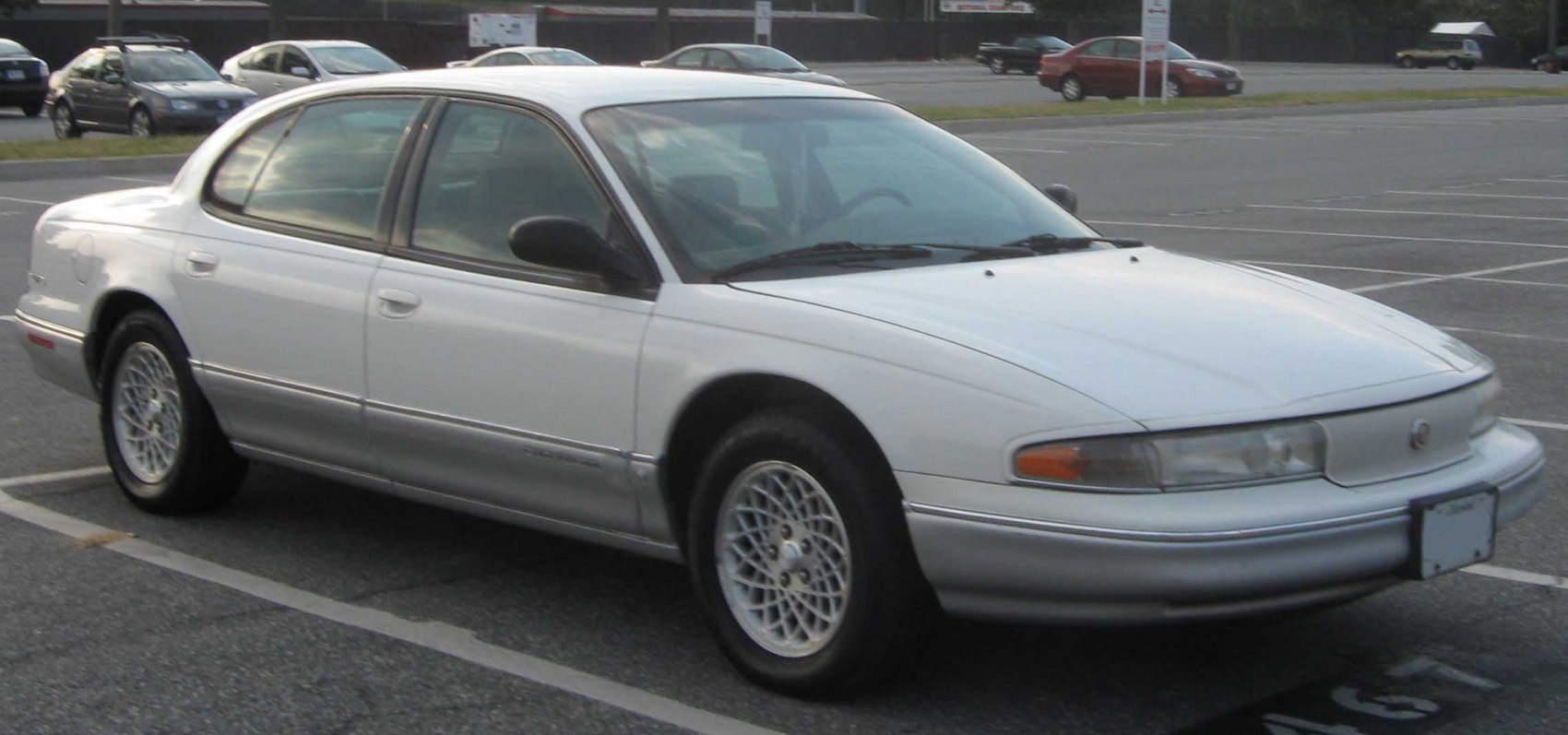 Sedan with mesh alloy wheels and smooth aerodynamic body