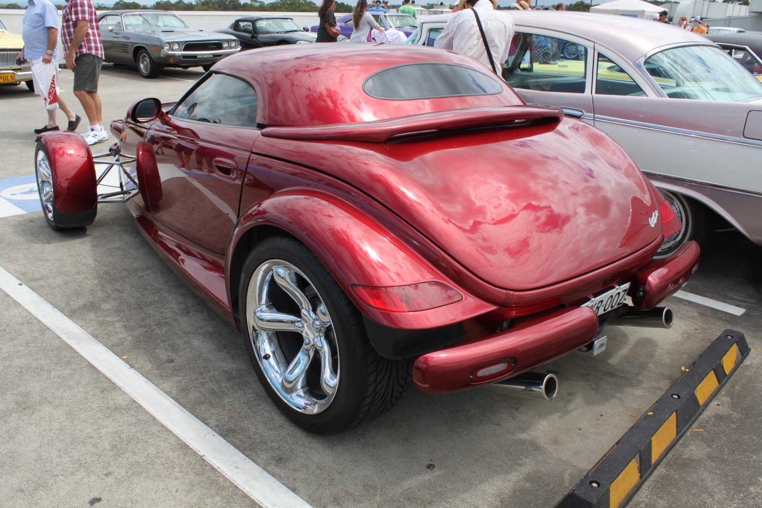 Red retro-styled rear with chrome wheels and dual exhaust