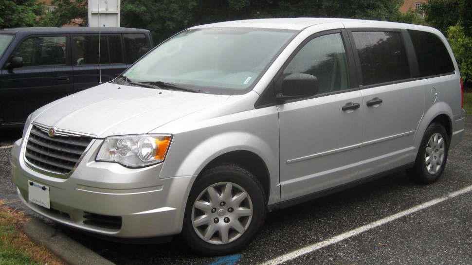 Silver minivan front-side profile with alloy wheels and aerodynamic body lines.