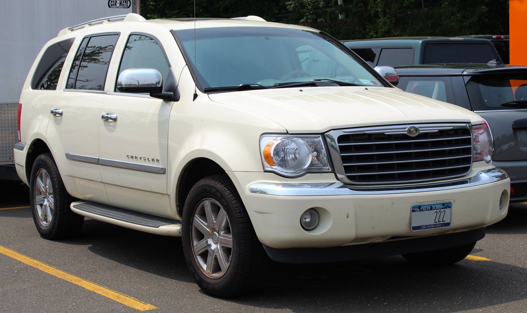 SUV with chrome grille, running boards, fog lights