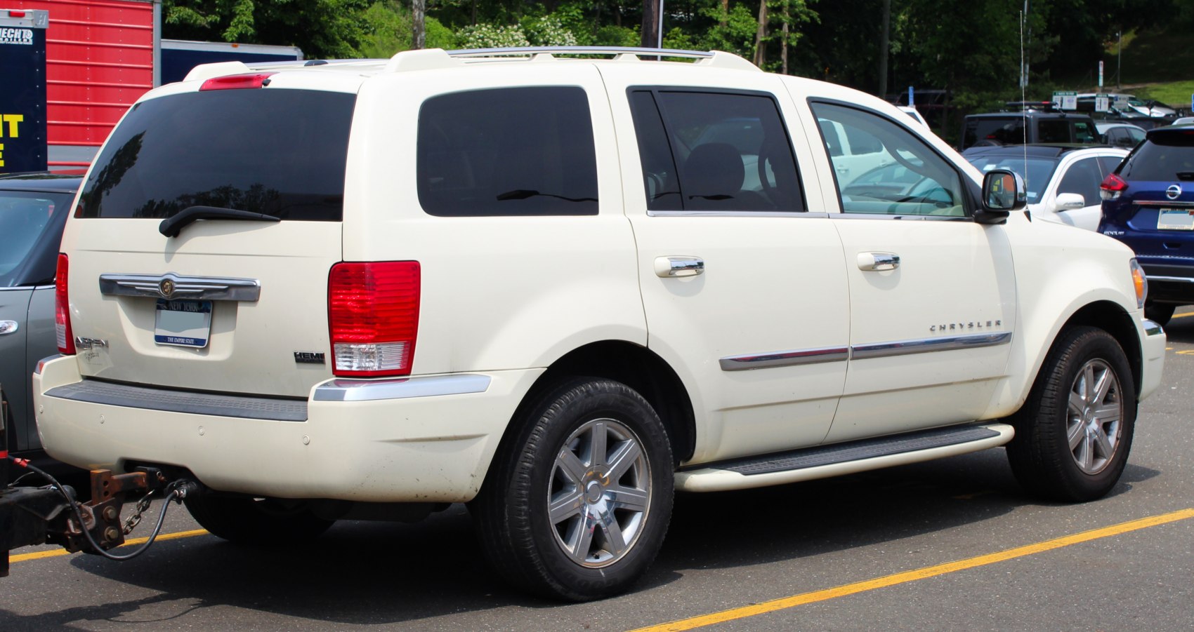 White SUV with roof rails and tinted rear windows