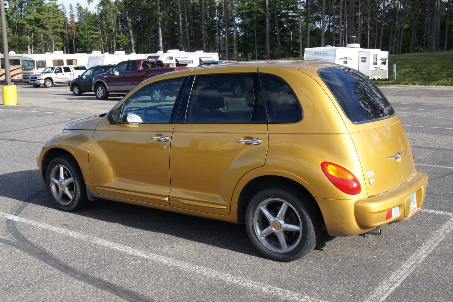 Retro rounded hatchback with chrome handles and tinted windows