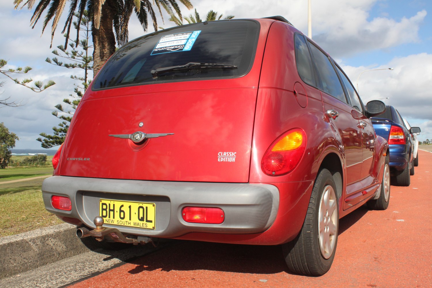Rear view of a classic edition vintage compact hatchback with distinctive tail lamps and tow hitch
