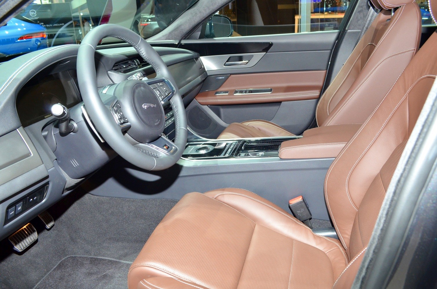 Luxury brown leather seats and modern dashboard with steering wheel