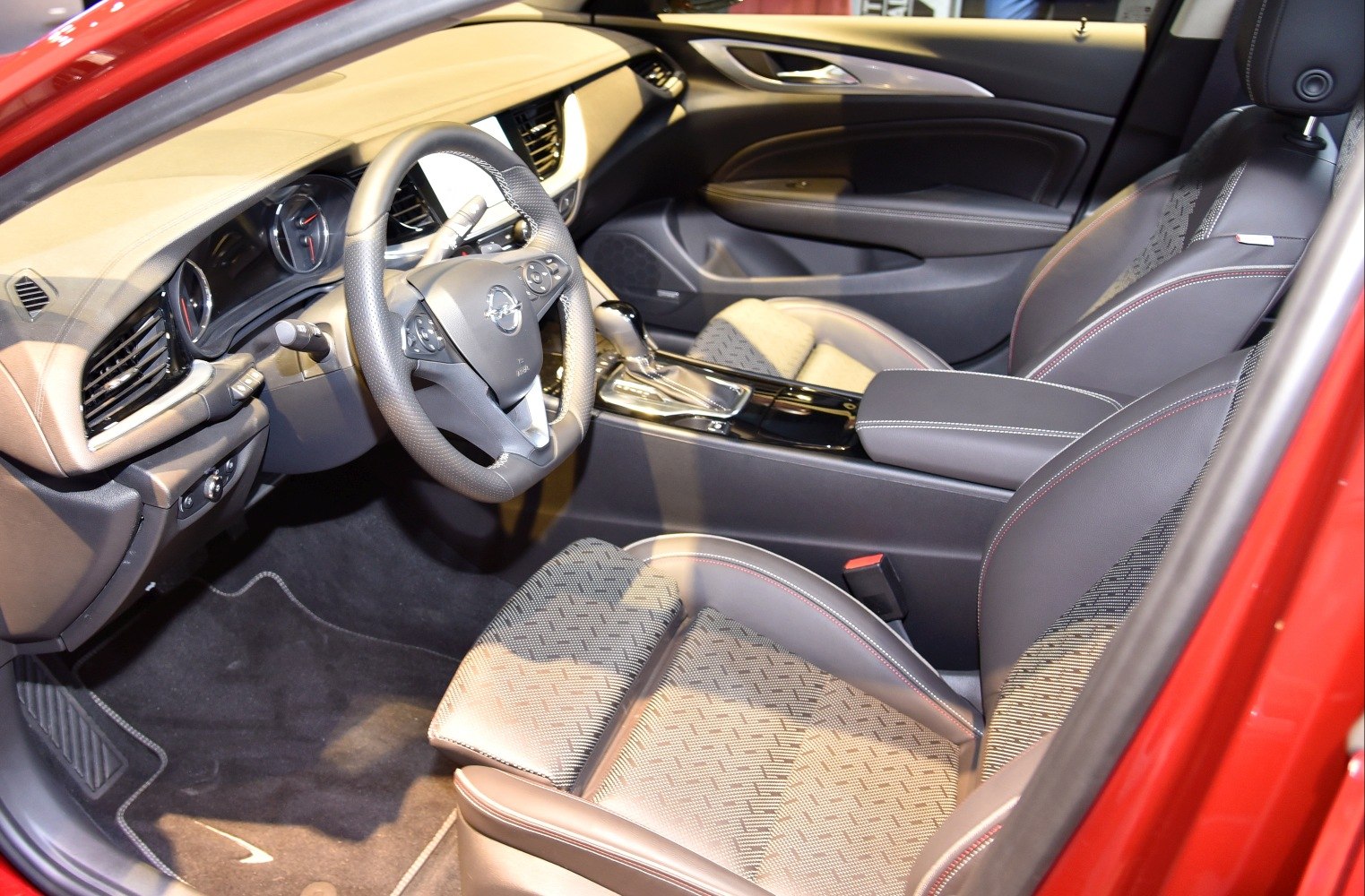 Steering wheel and patterned front seats with center console