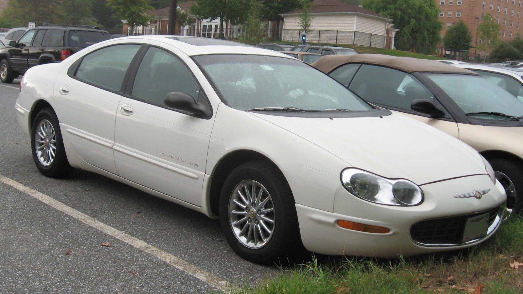 White sedan with oval headlights and alloy wheels