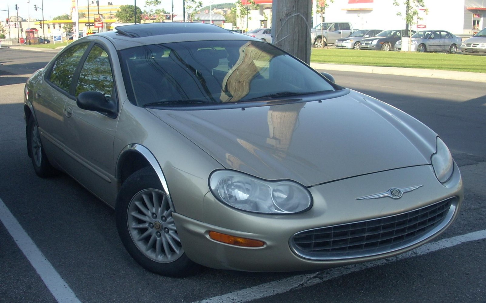 Rounded headlights and distinctive oval grille with alloy wheels