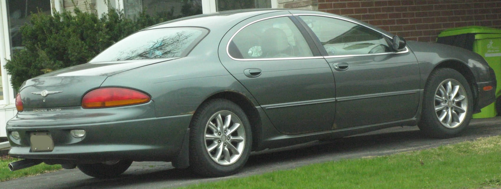 Rear and side view of a large sedan with alloy wheels and rounded tail lights
