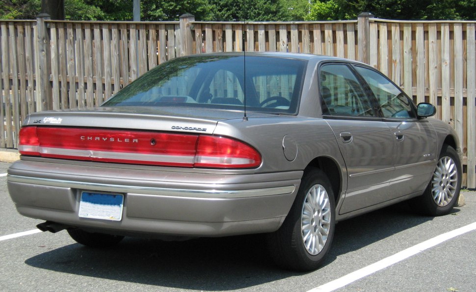 Rear view of a sedan with distinctive wide tail lights and smooth rear bumper.