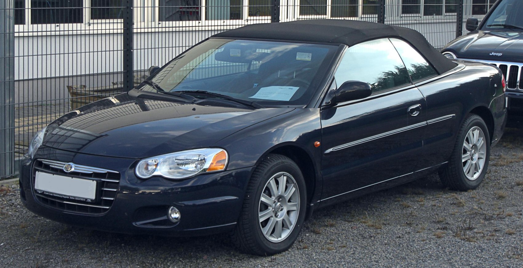Black convertible with soft top and alloy wheels
