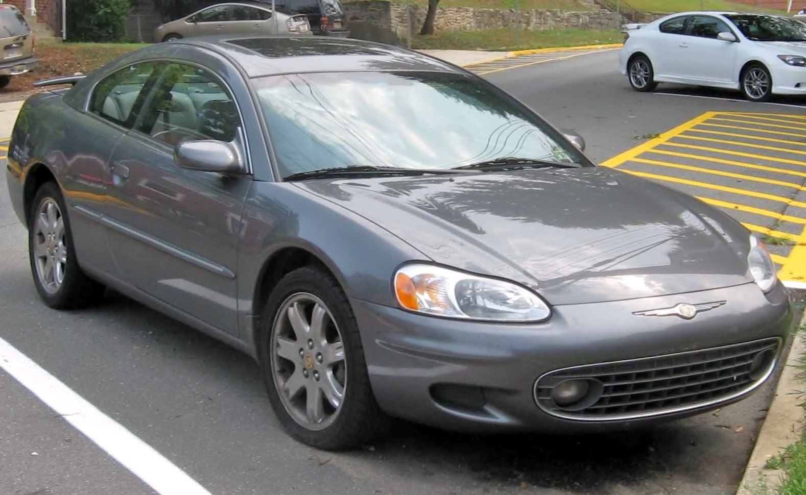 Gray coupe with smooth design and classic headlights