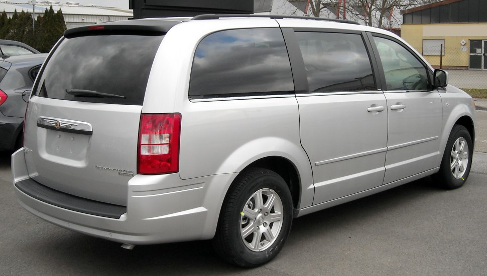 Silver minivan rear side with tinted windows and alloy wheels