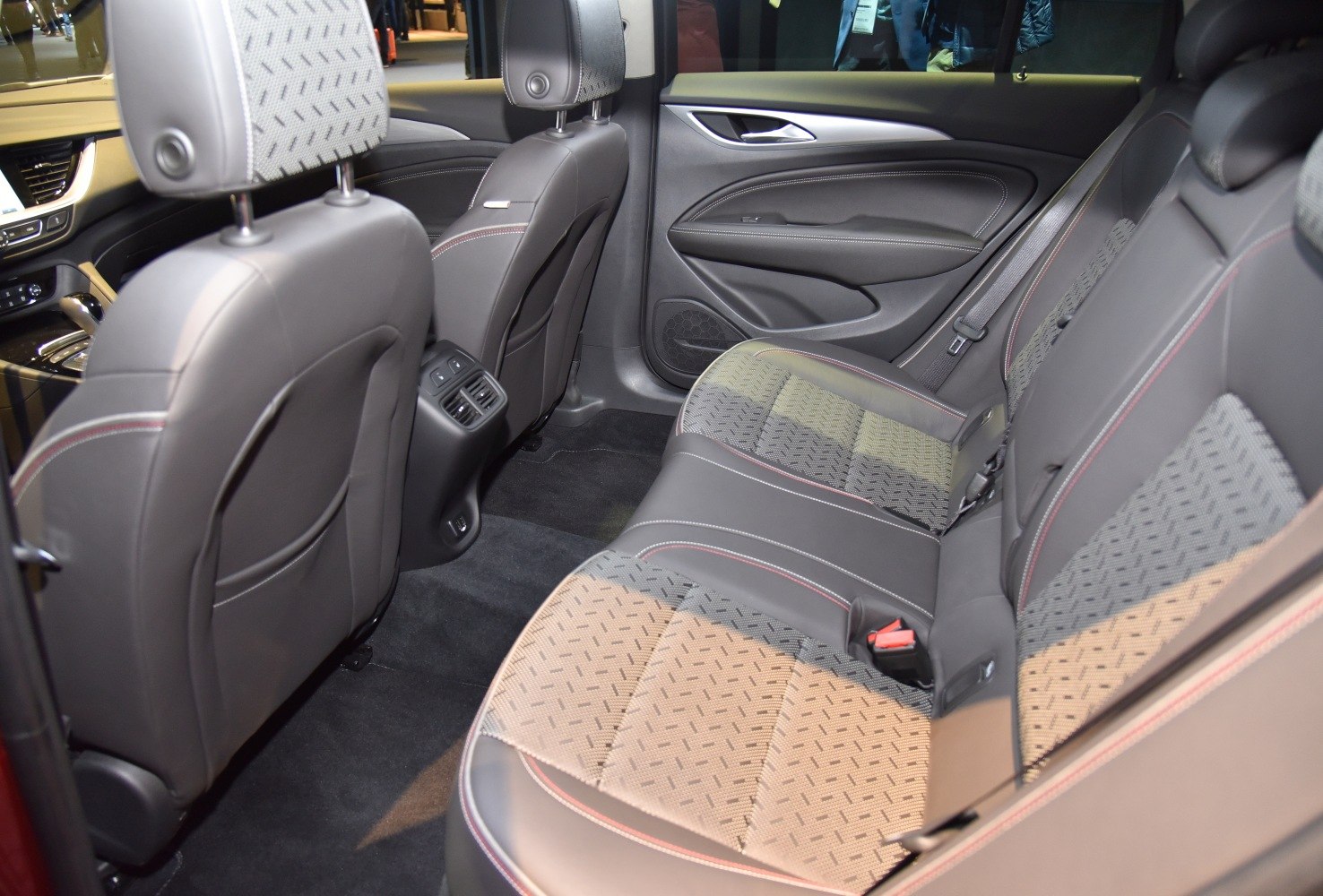 Rear seats with patterned upholstery and built-in air vents.
