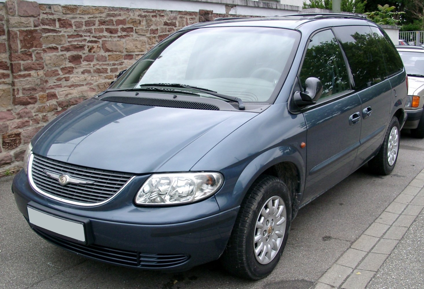 Minivan front side with grille and headlights