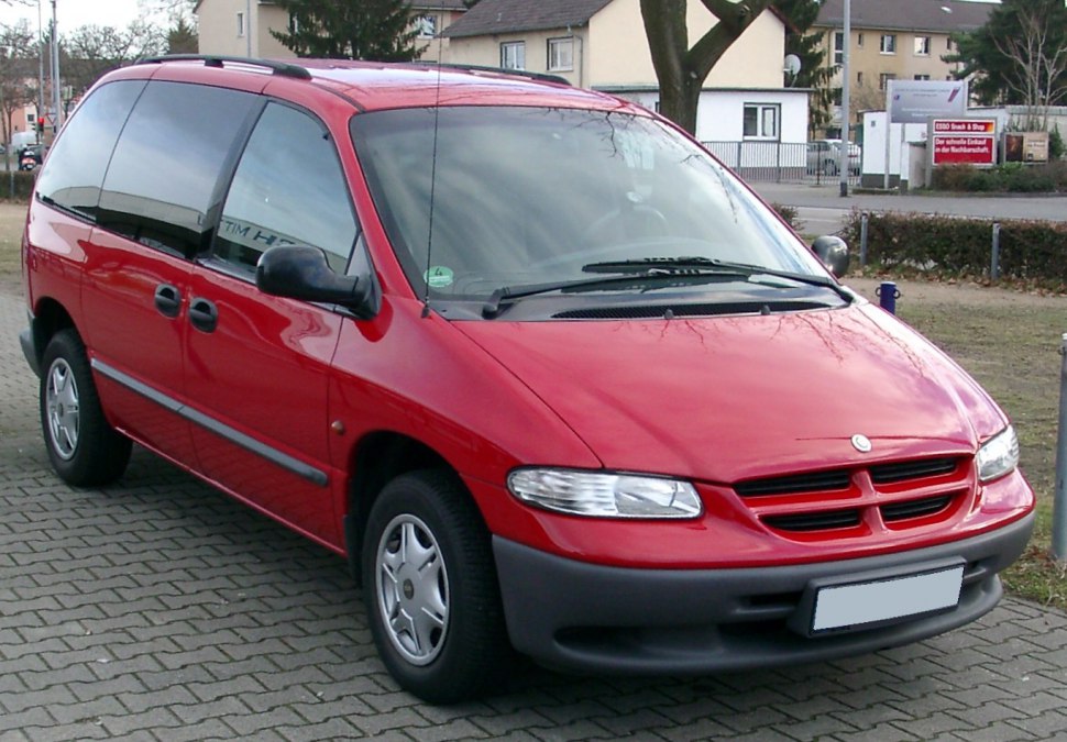 Red minivan front and side view with sliding doors and grille