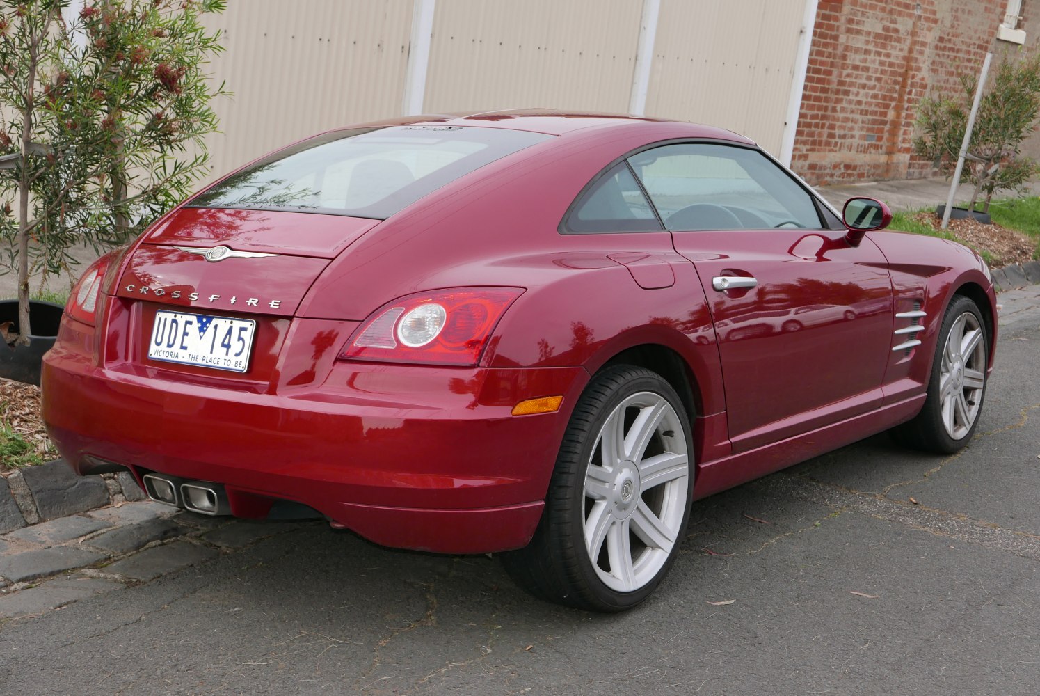 Sleek rear and side profile with distinctive tail lights and sporty body lines