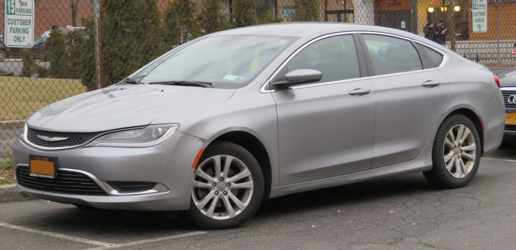 Aerodynamic mid-size sedan with alloy wheels and modern headlights
