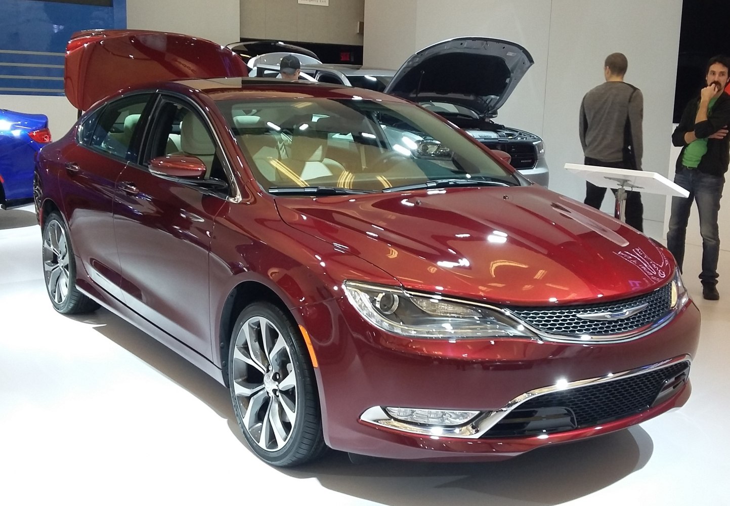 Red sedan with LED headlights and alloy wheels