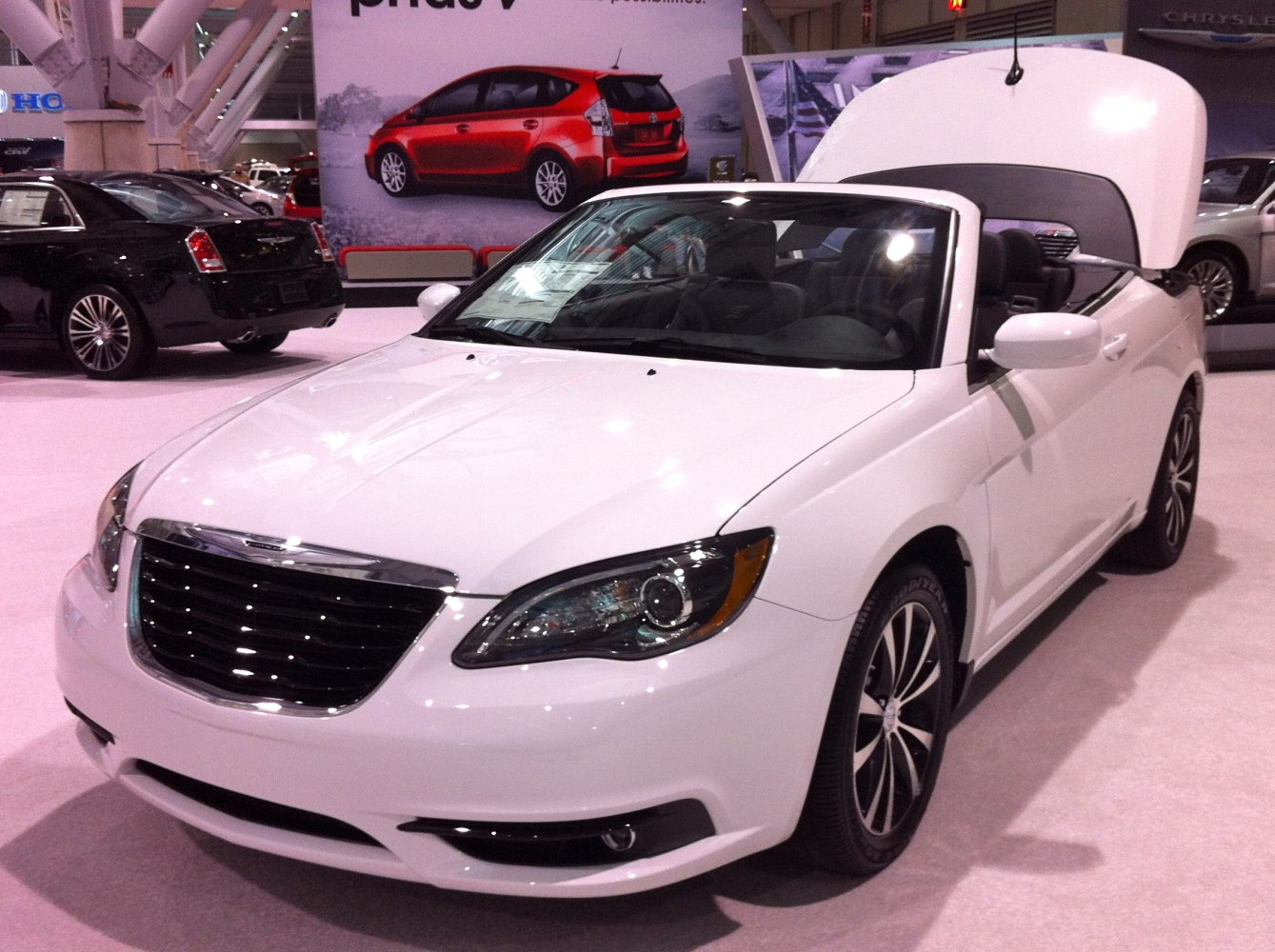 White convertible with sleek black grille and stylish headlights