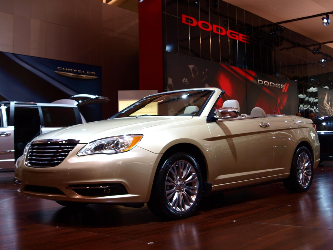 Front-side view of a convertible with open roof and sleek headlights