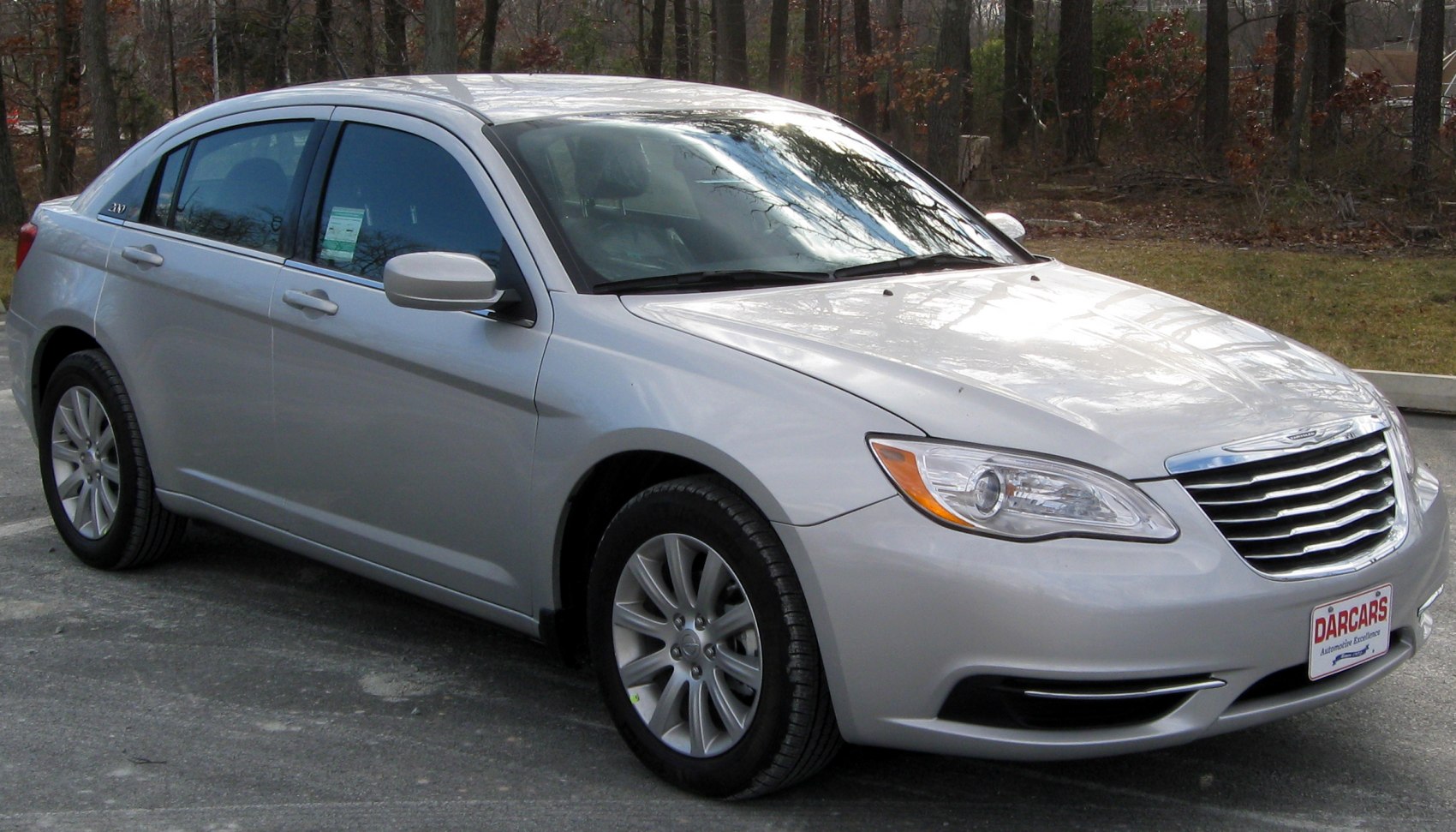 Front side view with distinctive grille and alloy wheels