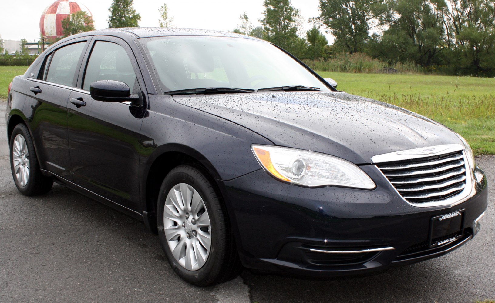 Front-side view with chrome grille and alloy wheels