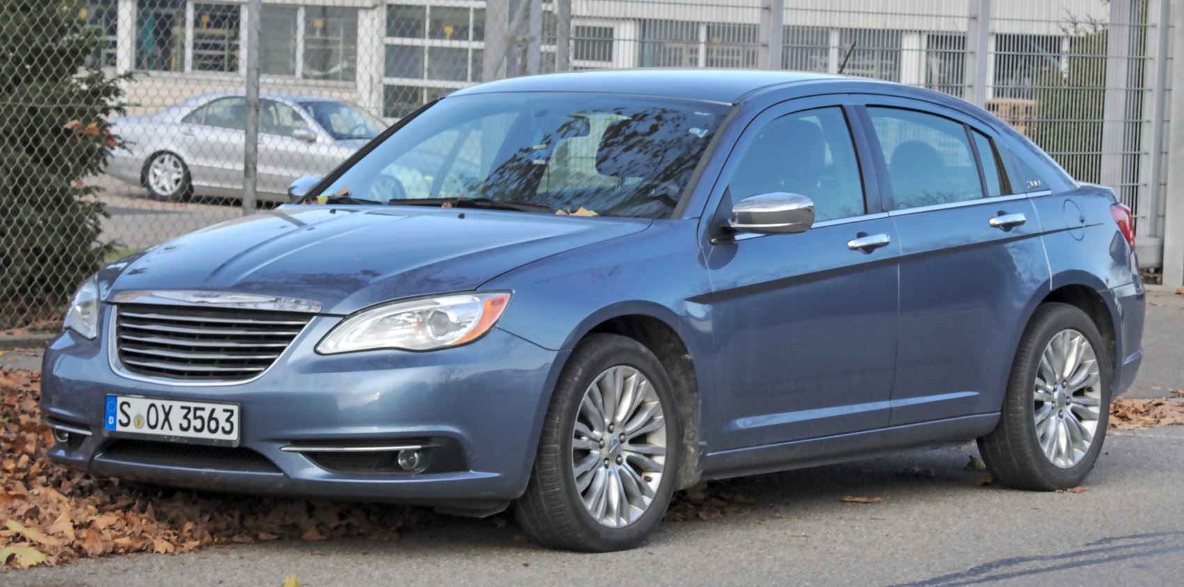 Mid-size sedan with chrome grille and multi-spoke alloy wheels
