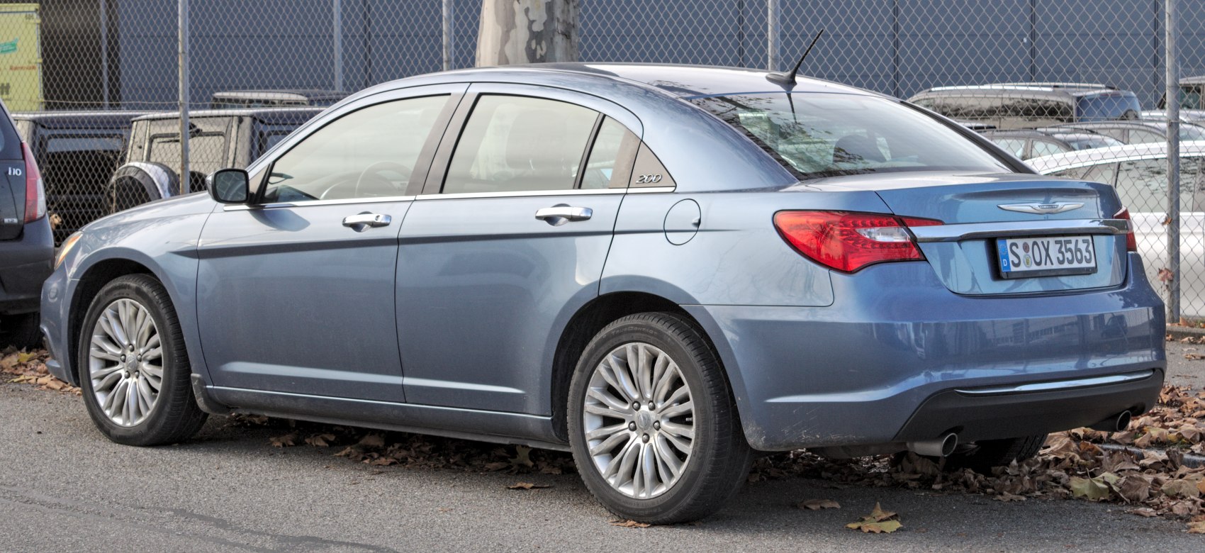 Rear-side perspective of a four-door sedan with alloy wheels and distinctive taillights