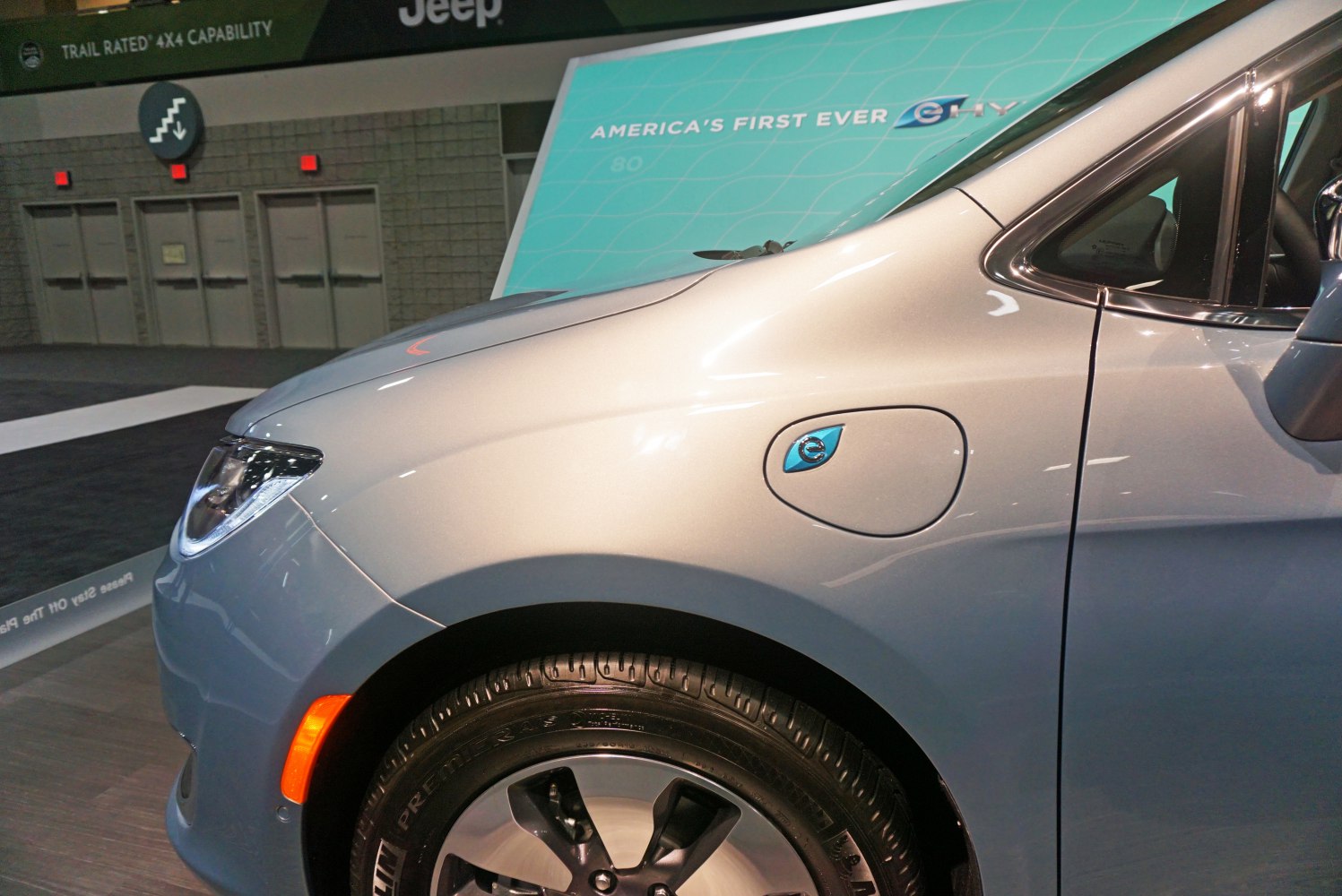 Electric charging port and front wheel close-up