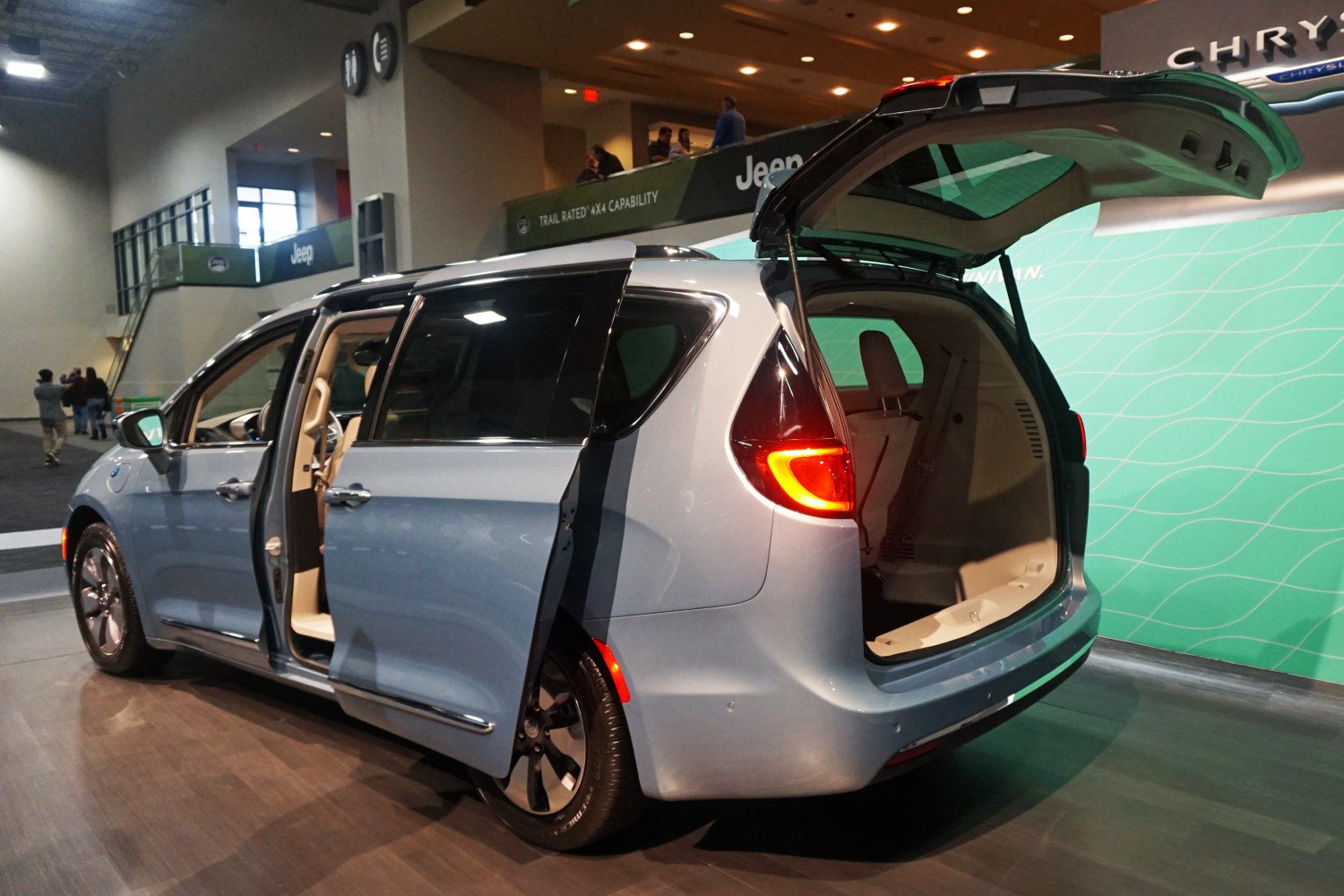 Spacious minivan with open sliding side door and rear liftgate