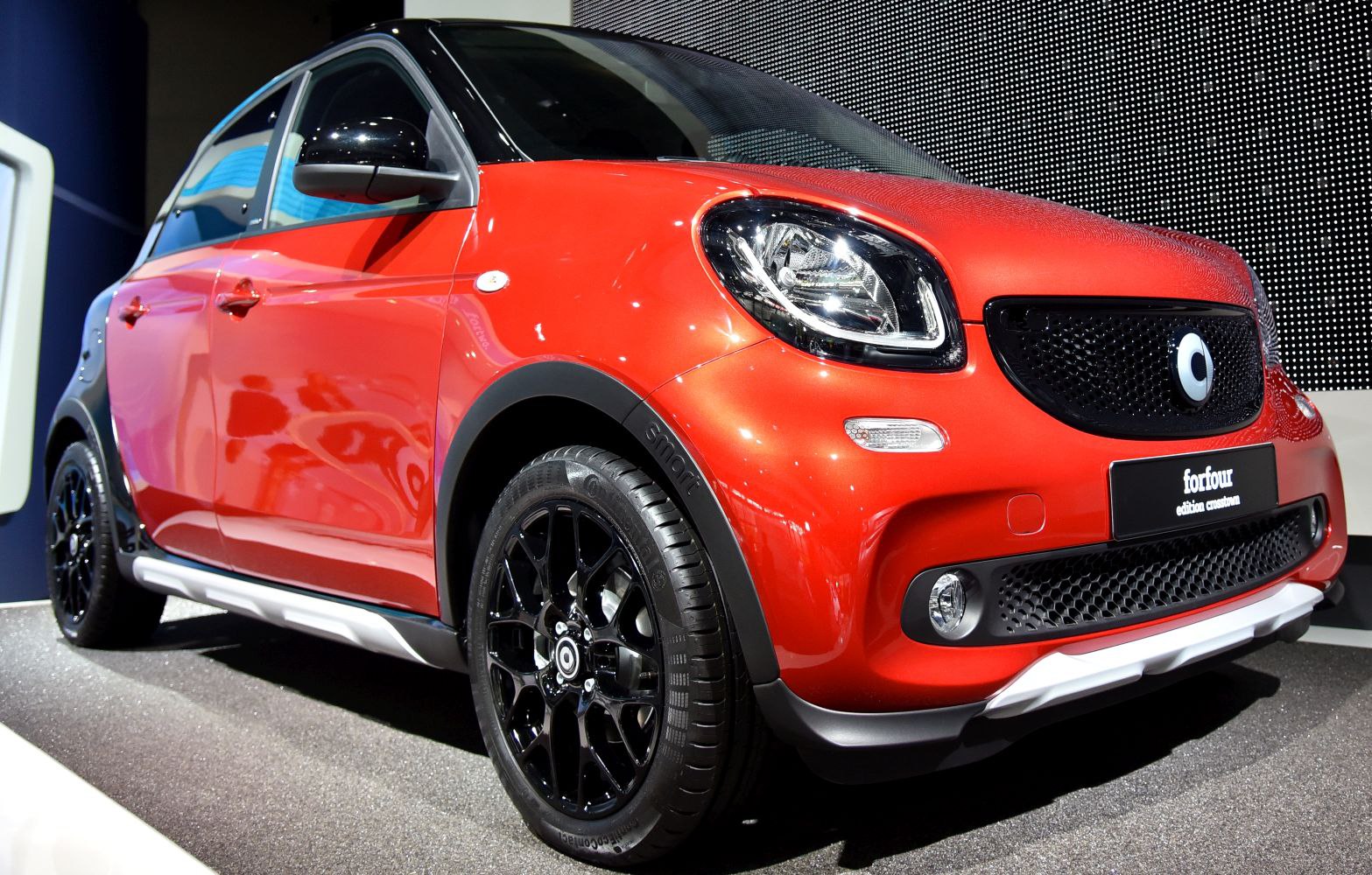 Front side with modern headlights and black alloy wheels