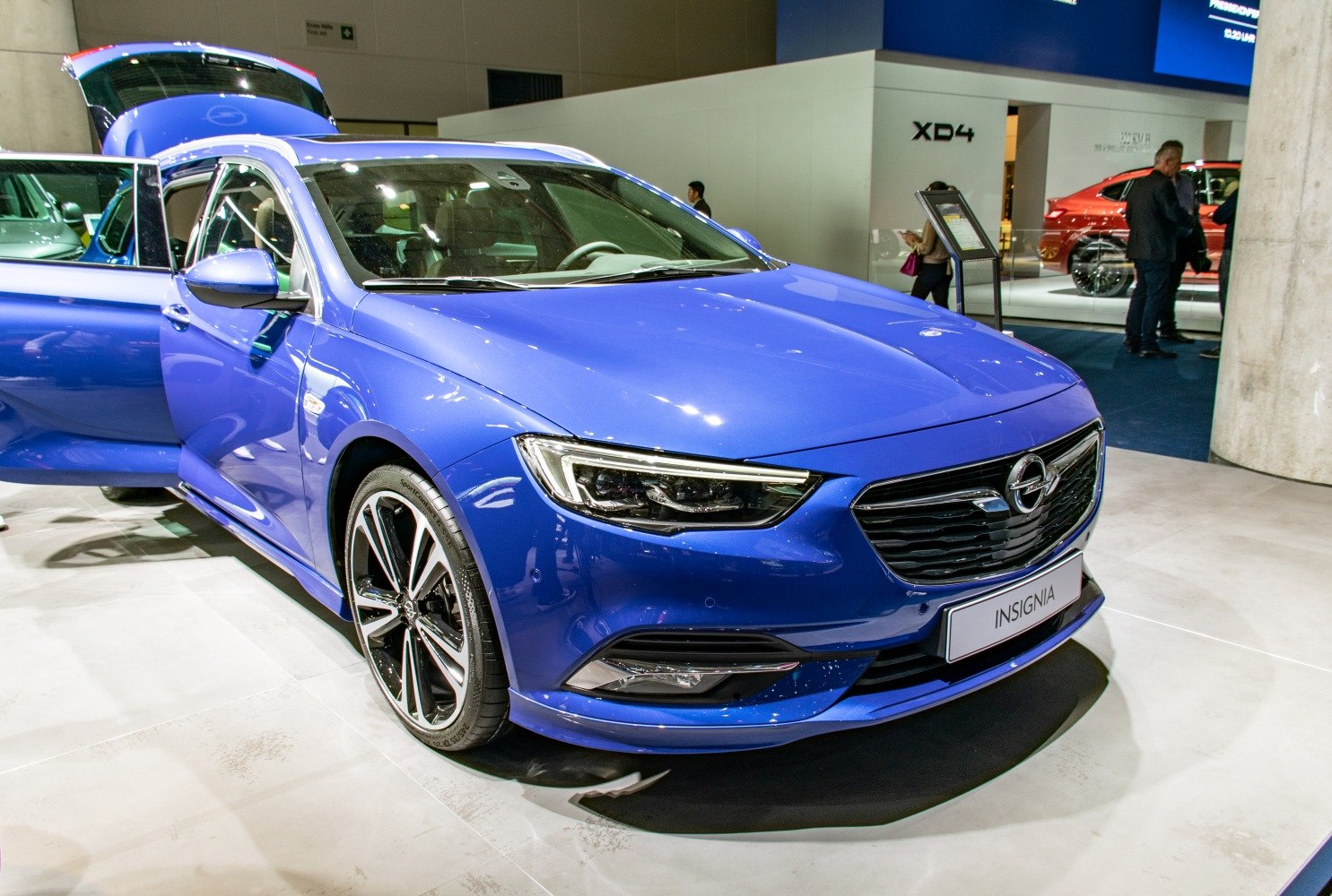 Front view of blue wagon with LED headlights and sporty alloy wheels