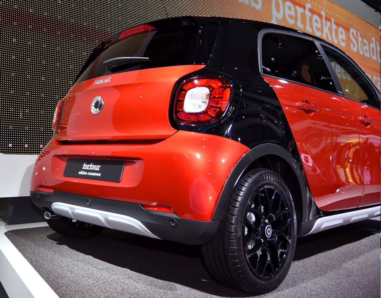 Rear and side view with tail lights and black alloy wheels