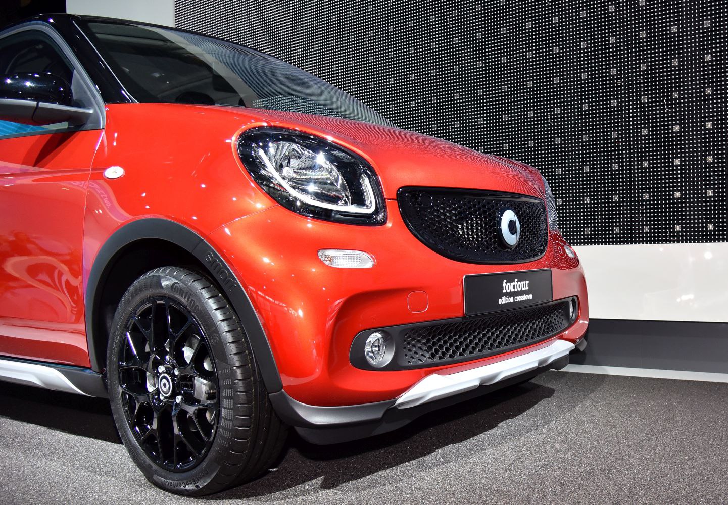 Front fascia with distinctive headlights and black alloy wheels
