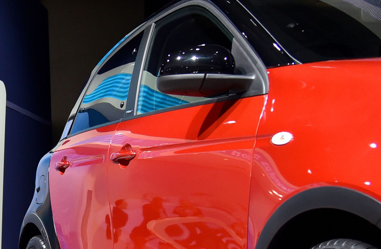 Close-up on car door and black side mirror