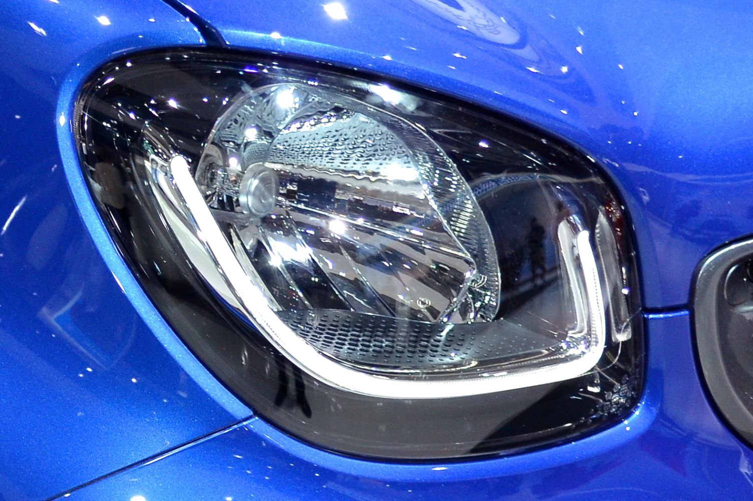 Close-up of modern front headlight with LED daytime running light