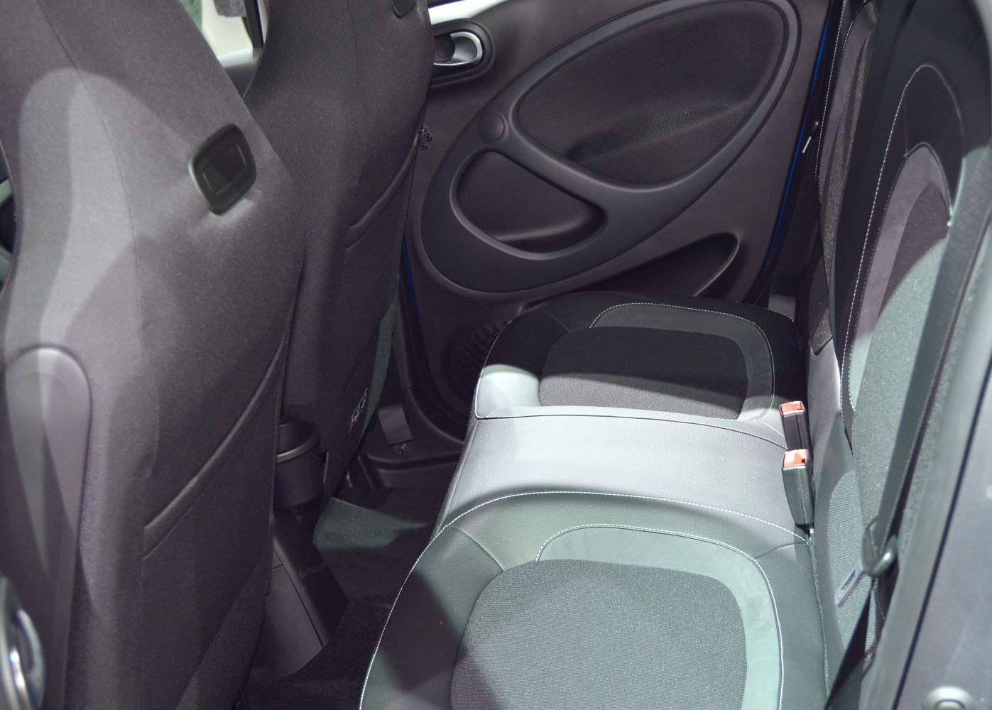 Rear seat and door panel interior with fabric and leather upholstery