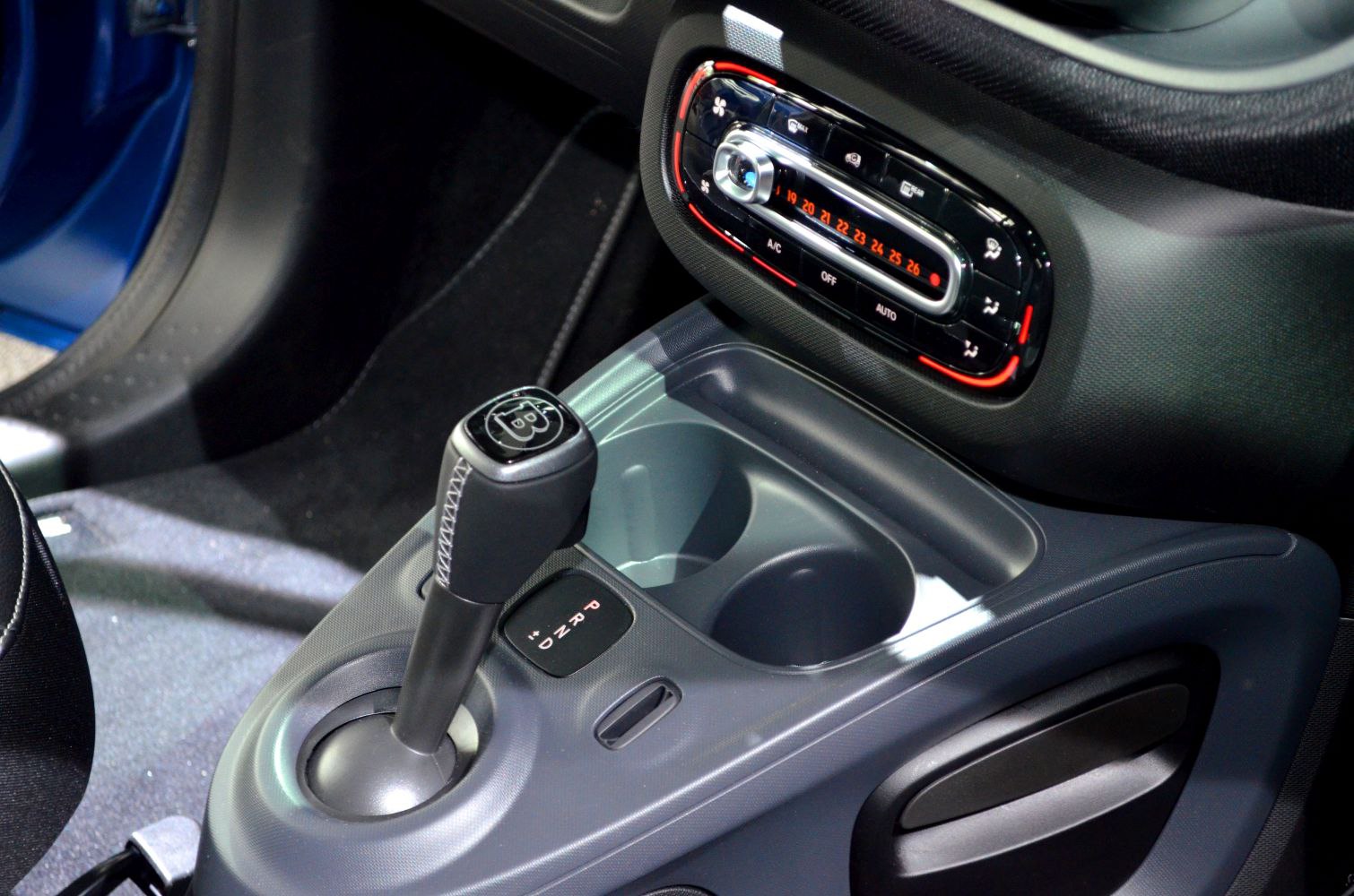 Gear shift lever and digital climate control panel with cup holders