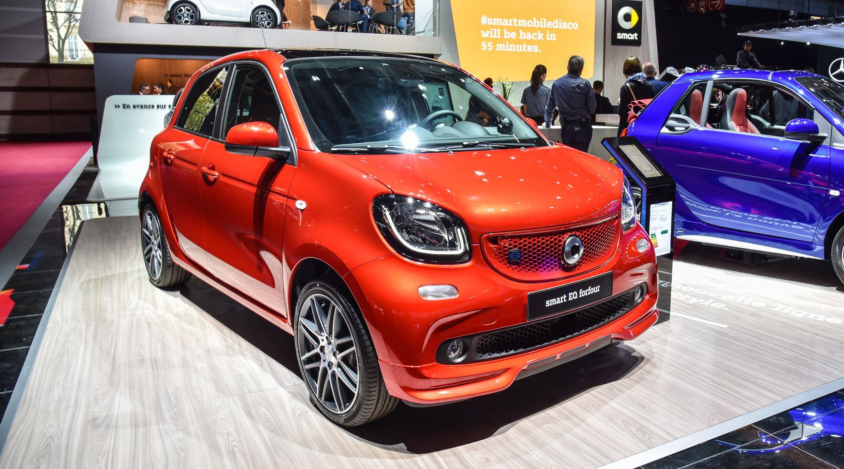 Front and side view of a compact electric hatchback with LED headlights and sporty styling