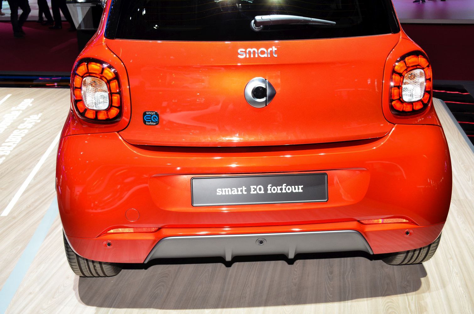 Rear view of an electric hatchback with distinctive taillights and badge
